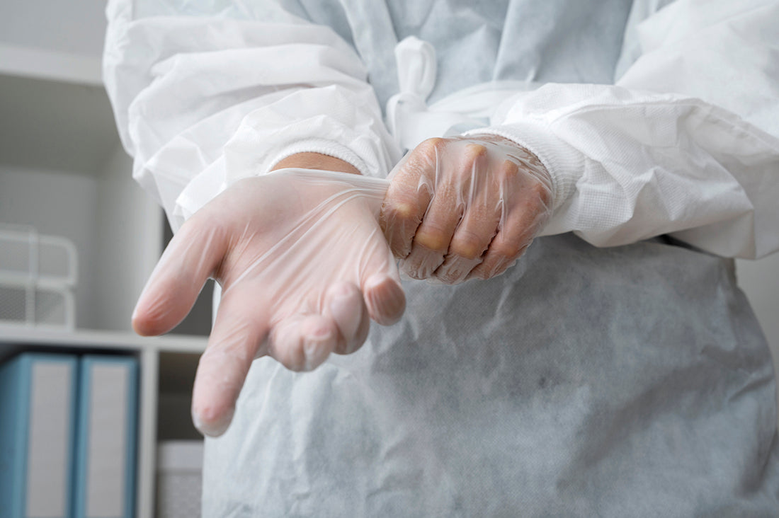 front-view-doctor-putting-gloves1.jpg__PID:7178e7d5-d9a9-4eec-8677-f5973d589f7d